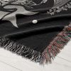 Close-up of Aries Spirit woven blanket, highlighting the detailed buffalo skull and stars.