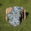 Blue-Blossom-Woven-Blanket-lies-on-the-chair