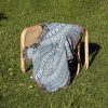 Blue-Ornament-Woven-Blanket-lies-on-chair