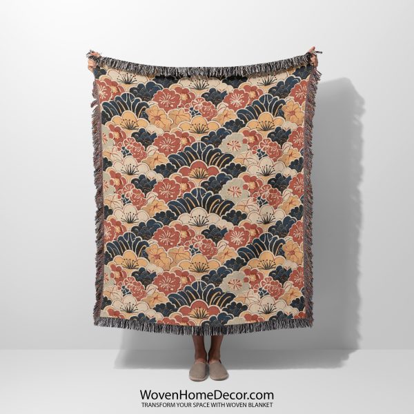 Japanese style woven blanket held by woman, featuring bold patterns and striking contrast.