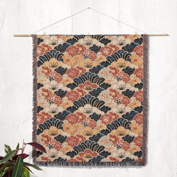 Japanese style woven blanket hanging on wall as tapestry, showcasing bold patterns and textures.