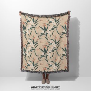 Japanese style woven blanket held by woman, with subtle floral patterns and soft, calming tones.