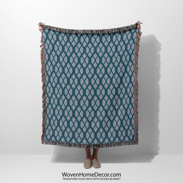 A Scandinavian Geometric Woven Blanket held by a person; only the blanket is visible.