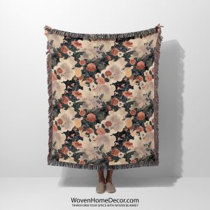 Vintage-inspired floral woven blanket held by woman, featuring soft, faded flowers in nostalgic colors.