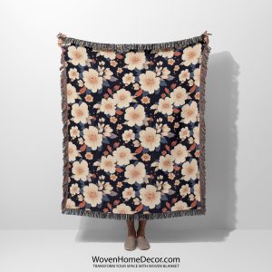 Floral woven blanket held by woman, featuring exotic, tropical flowers in bright, bold colors.