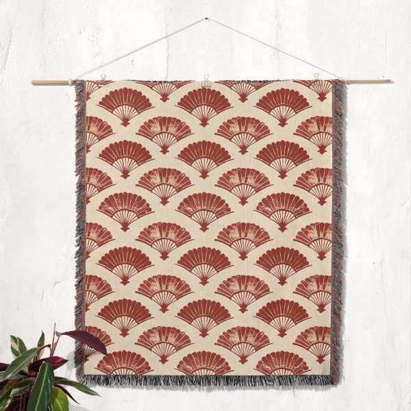 Japanese style woven blanket hanging on wall as tapestry, featuring traditional design and vibrant colors.