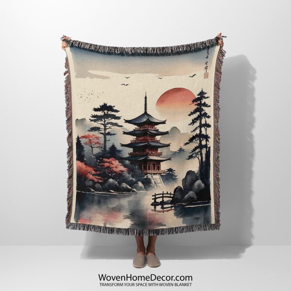 Japanese style woven blanket held by woman, featuring Tranquil Temple and muted tones.