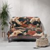 Japanese style woven blanket on couch, creating a serene and elegant atmosphere in the room.