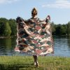 Woman wrapped in Japanese style woven blanket, back view, with warm fan design.