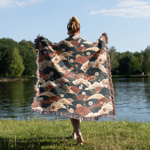 Woman wrapped in Japanese style woven blanket, back view, with warm fan design.