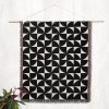 Modern Geometric Woven Blanket hanging on the wall as a tapestry, emphasizing the bold pattern.