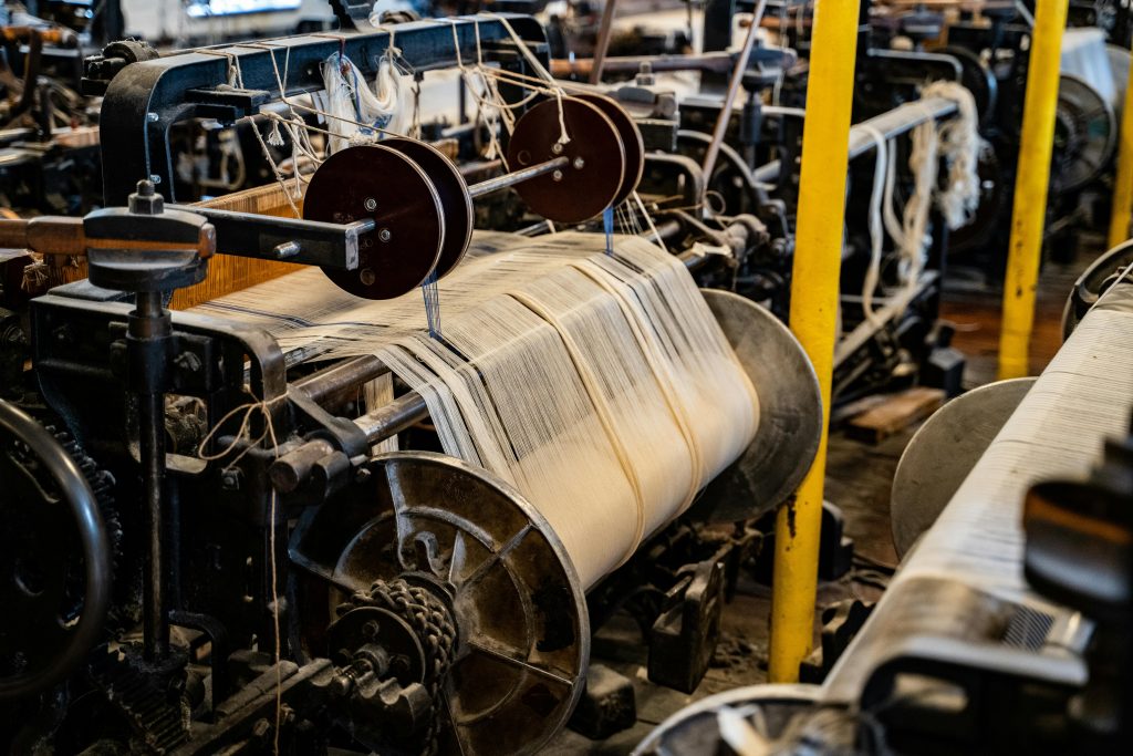 Detailed view of a vintage textile machine showcasing industrial sewing equipment.