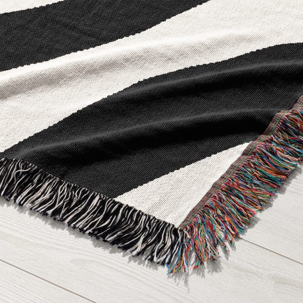 Close-up of the bold black-and-white abstract pattern on the Scandinavian Woven Blanket.