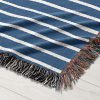 Close-up of the navy blue and white stripes on the Scandinavian Woven Blanket.