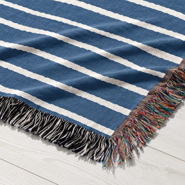 Close-up of the navy blue and white stripes on the Scandinavian Woven Blanket.