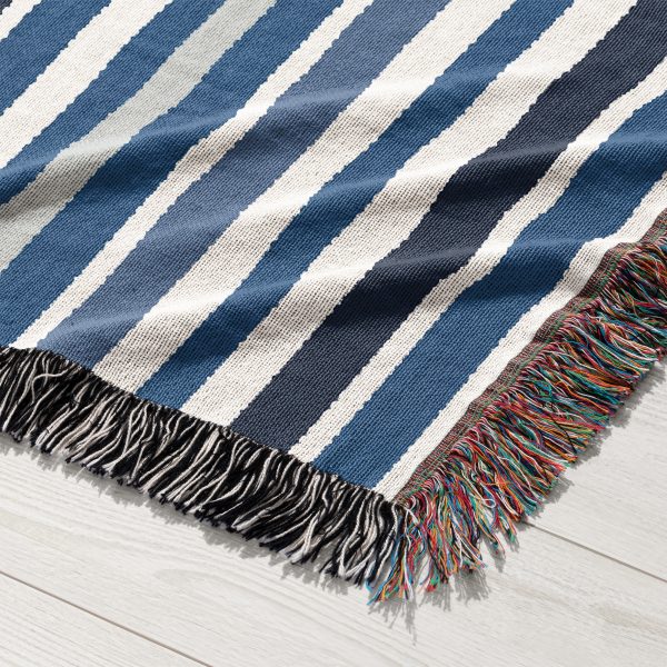 Close-up of the navy blue and gray horizontal stripes on the Scandinavian Woven Blanket.