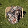 tribal_sunset_woven_blanket_onthechair