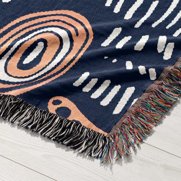 Detailed view of the organic-patterned woven blanket, showcasing its artistic textures.