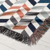 Close-up of the chevron pattern on the Scandinavian Chevron Harmony Woven Blanket.