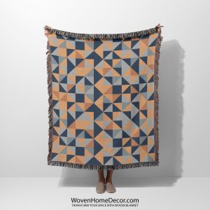 Main photo of the Scandinavian Geometric Mosaic Woven Blanket held by a person, person not visible.