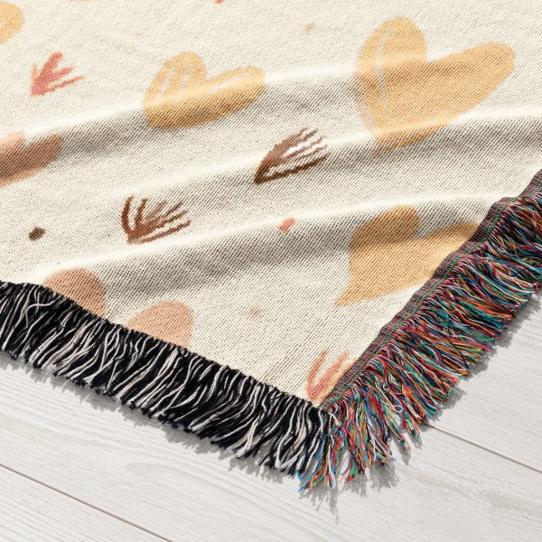 A close-up of the serene design and soft woven texture of the Enchanted Hearts Woven Blanket.