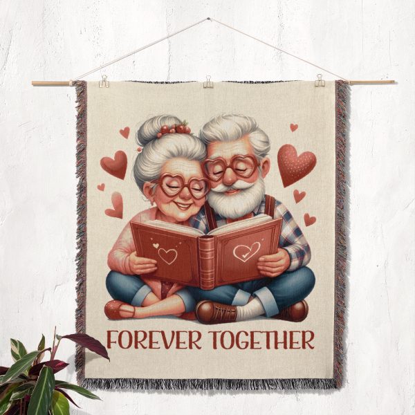 The woven blanket with the elderly couple design displayed as a wall tapestry.