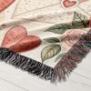 Close-up view of the intricate floral and heart motif woven into the blanket