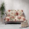 The Romantic Floral and Heart Motif blanket covering a sofa, adding a touch of elegance to the space