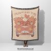 A Vintage Car Bears woven blanket, held up by an unseen person